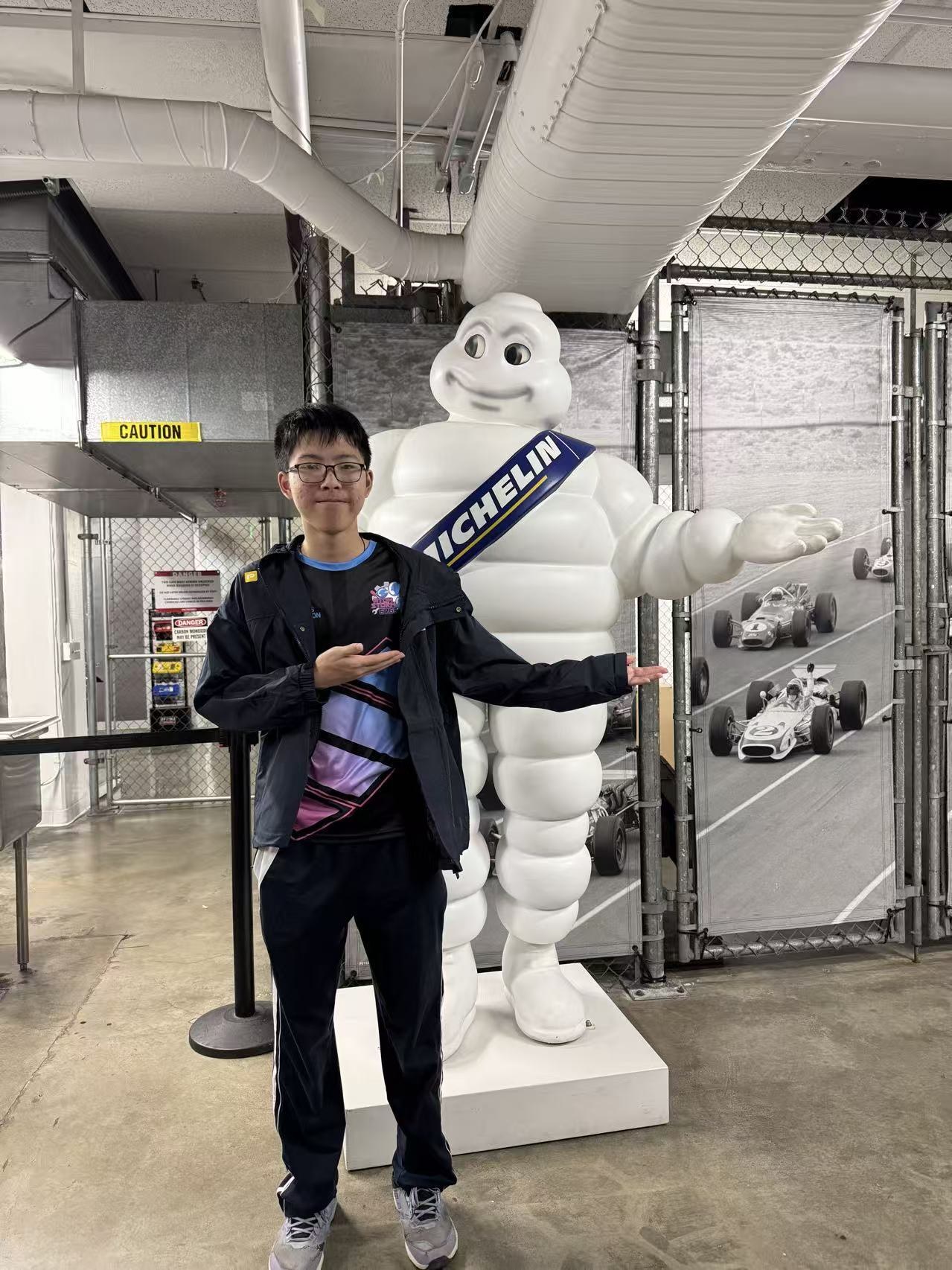 Jeffrey in his FRC team jacket next to the Michelin tire-man exhibit in Houston