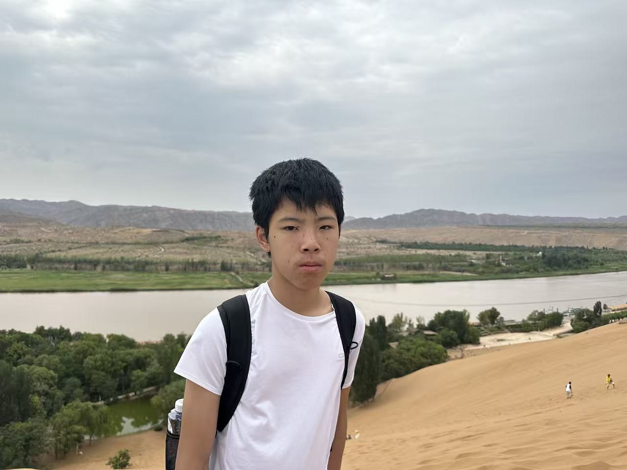 Jeffrey in the desert by the Yellow River during a Dunhuang research trip