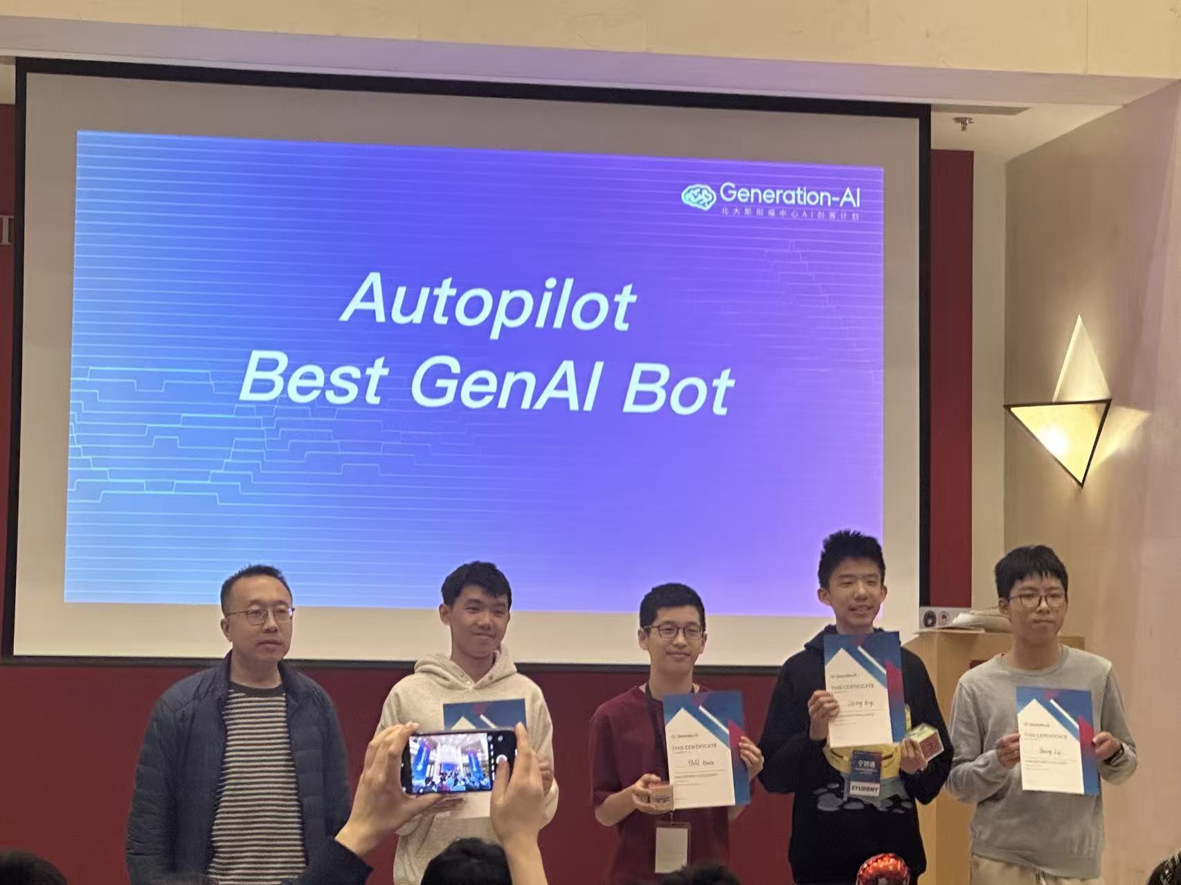 Receiving the Autopilot Best GenAI Bot award on stage at Generation-AI