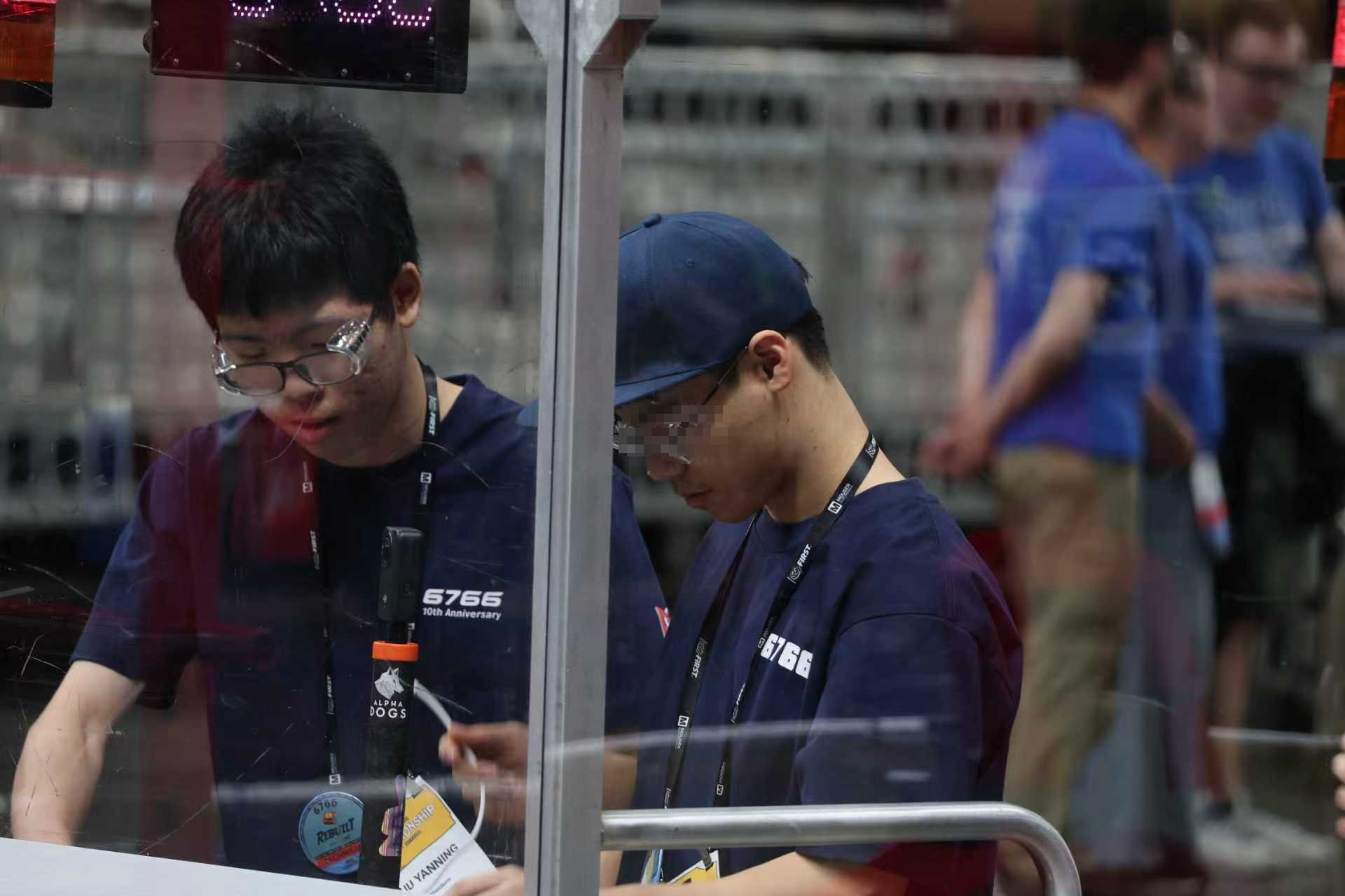 Preparing robot 6766 in the pit at a competition